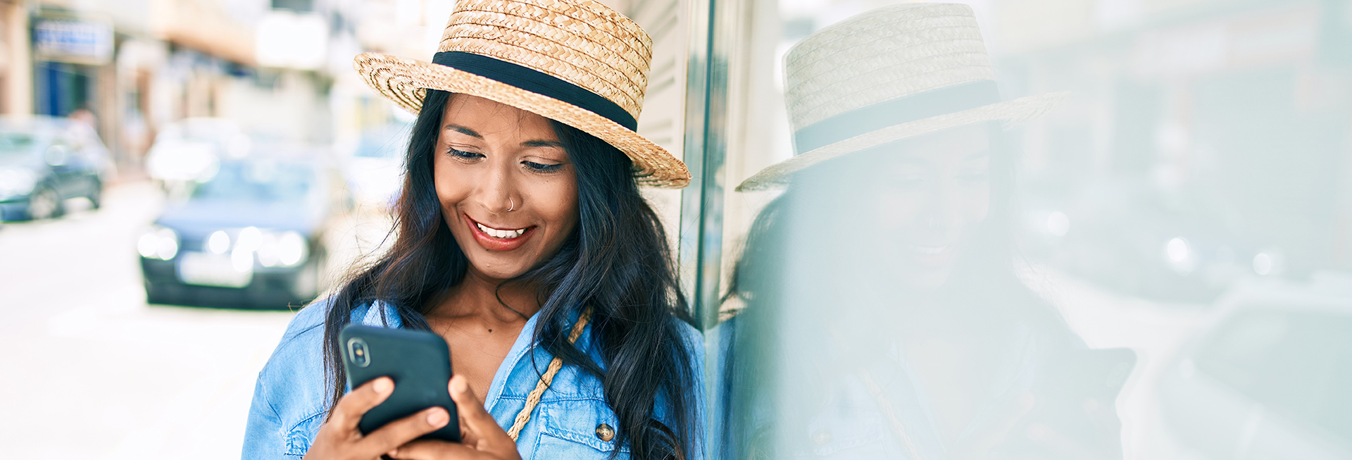 Young woman smiling at smartphone