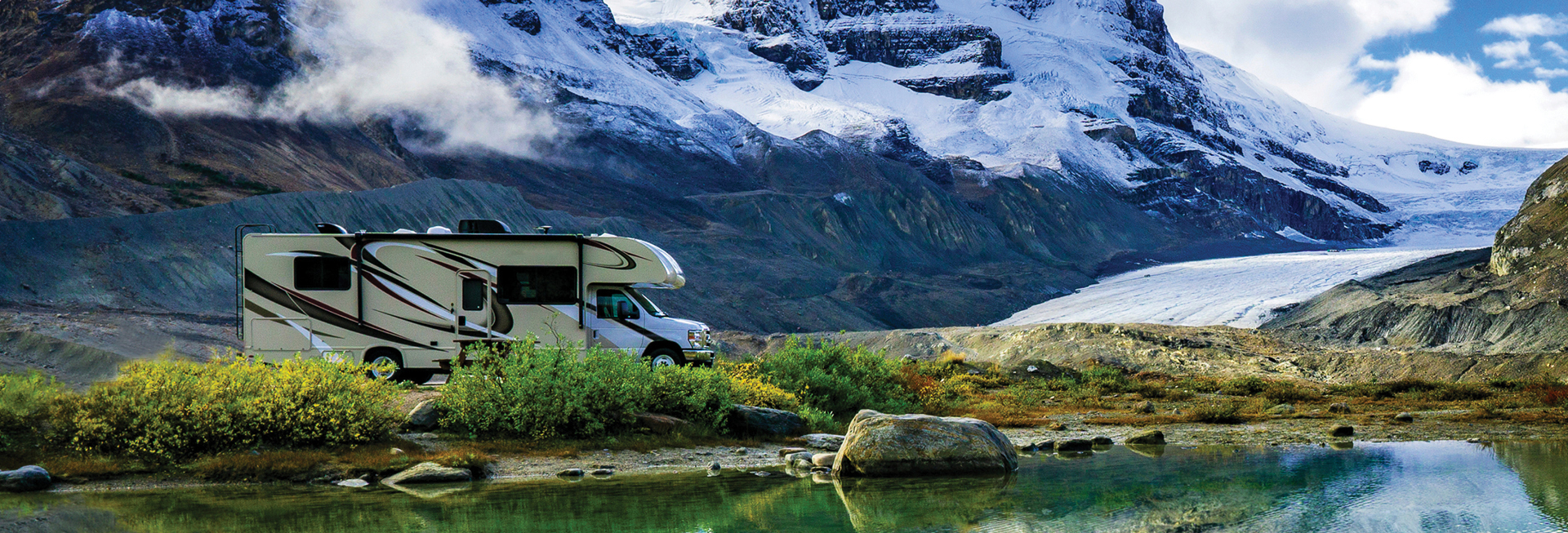 RV with snowy mountain backdrop